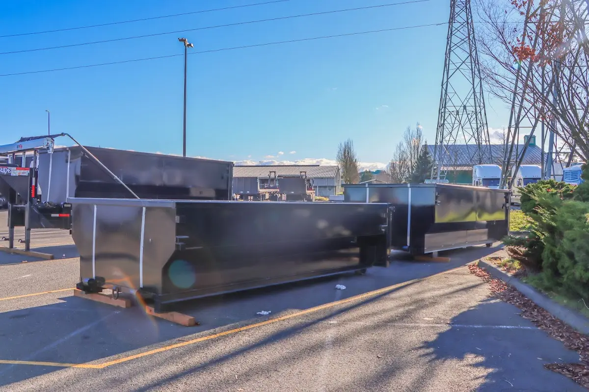 Roll-off dumpster ready for waste disposal at job site for Demolition Dumpster Rental in Charter Oak